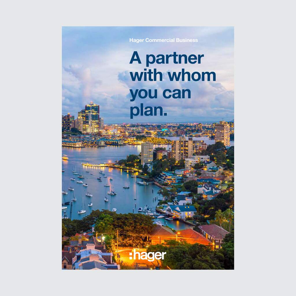 Hager commercial business advertisement featuring an urban skyline at dusk with the tagline 'A partner with whom you can plan.'