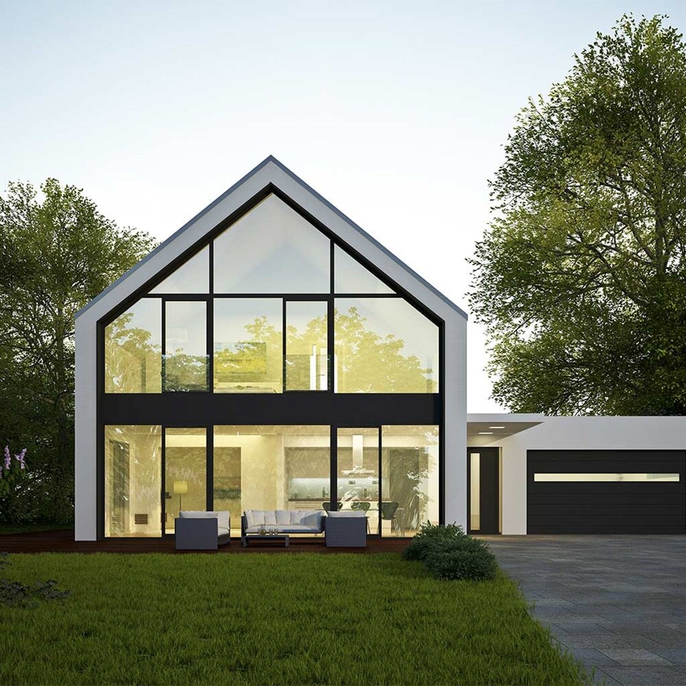 Modernes Haus mit großen Fenstern und einer Garage in der Dämmerung