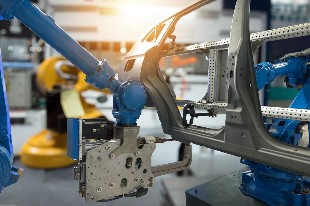 Industrial machine for automotive production 4.0 with robot arm