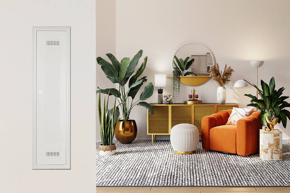 Modern living room interior with a flush-mounted electrical distribution panel on the wall, stylish furniture, and indoor plants