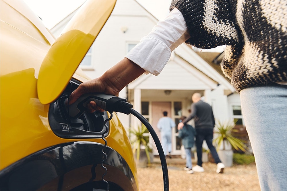 Hager Group Vehicule to home charging a yellow car