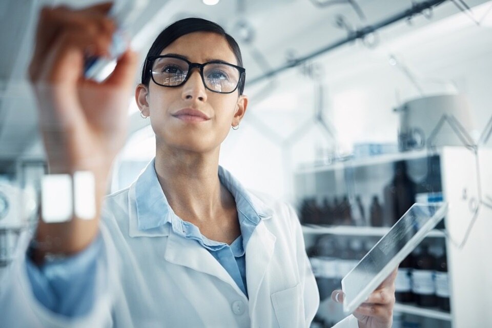 Female scientist using digital methods for medical research