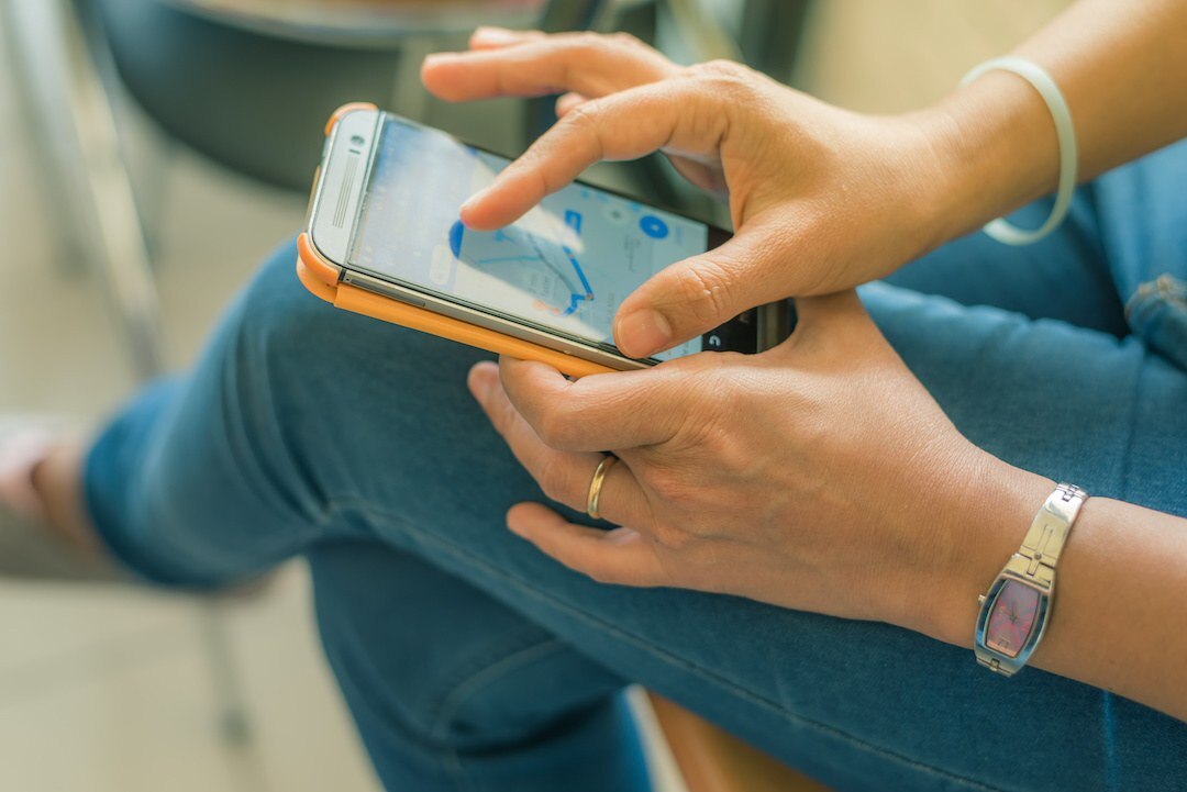 Woman uses map function of her smartphone