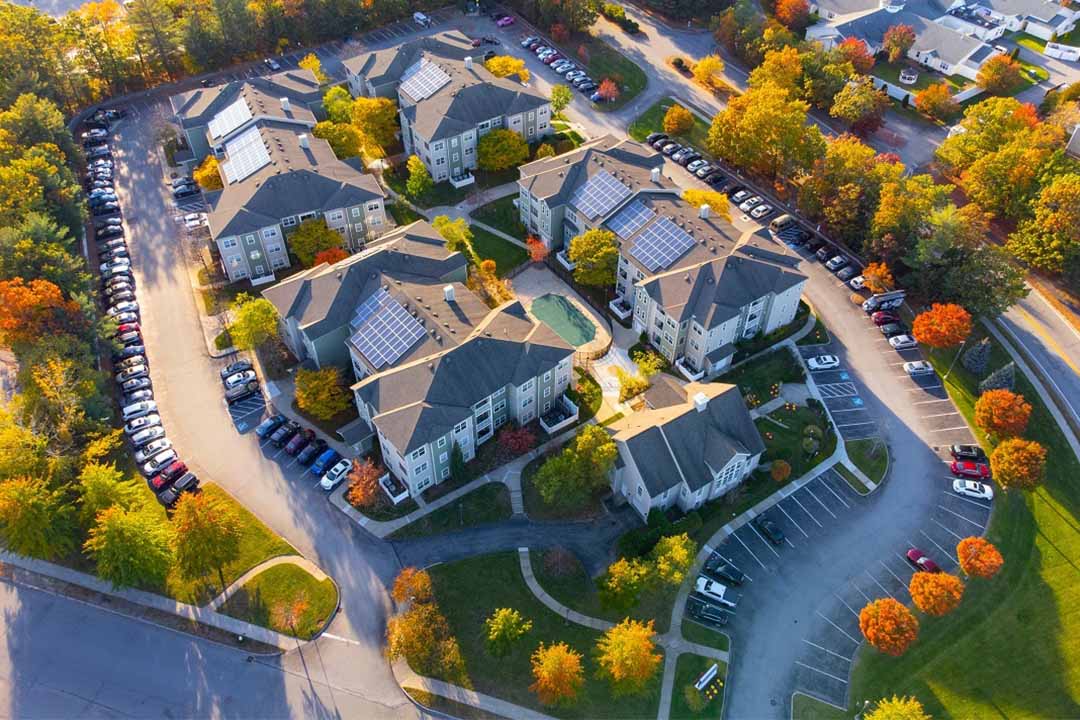 Aerial view of apartment block with photovoltaic system