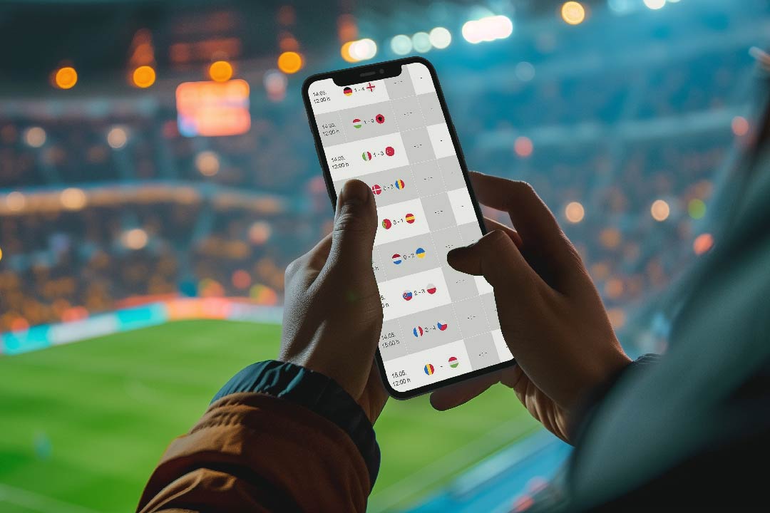 man on mobile phone predicting soccer scores2