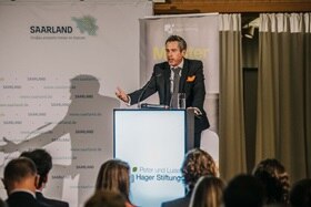 Speaker presenting to audience