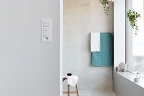 Hager Group Open bathroom with window front and switches from the kallysto and robusto range