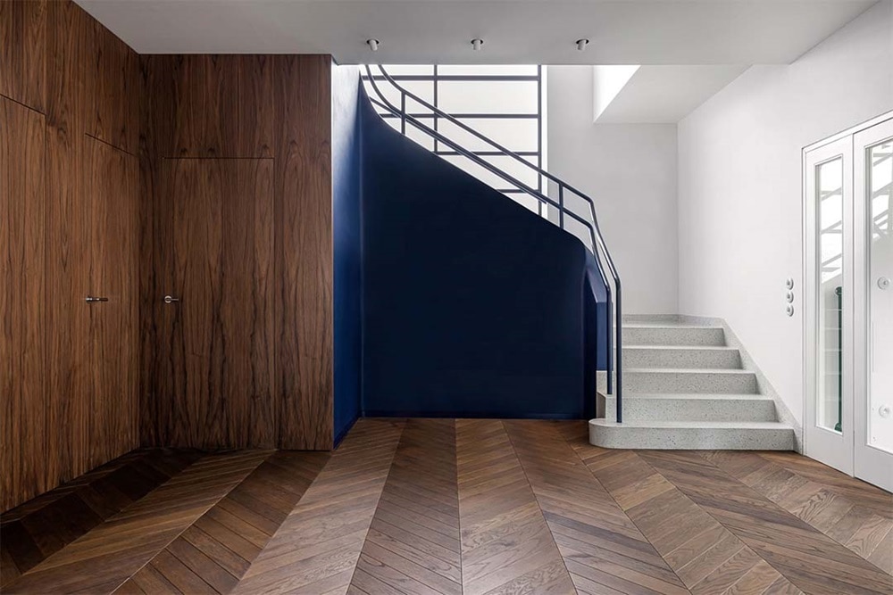 hager group brown and blue design staircase with dark brown wood