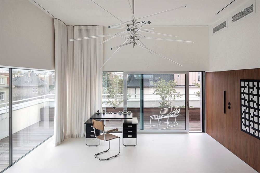 hager group open designer living room in clean colours with open front to the terrace