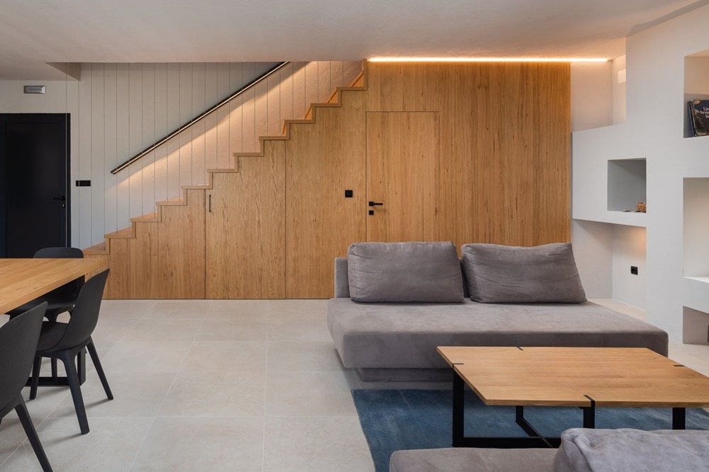 Hager group Designer Living Room with Wooden Wall and Grey Sofa with Wooden TV Table