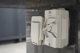 Hager outdoor socket on a gray wall 5