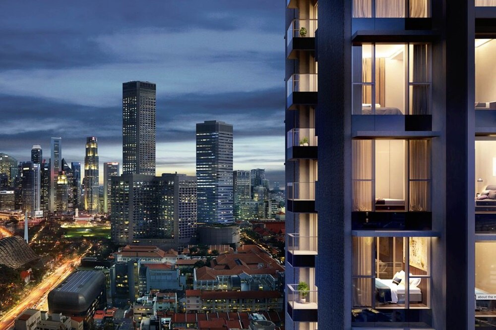 Luxury high-rise with city skyline at night