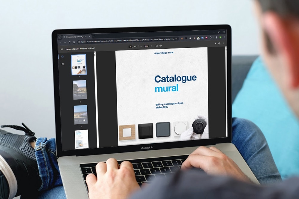 Catalogue appareillage mural Hager ouvert sur un écran d'ordinateur portable