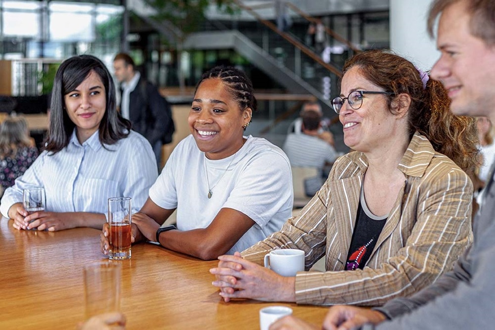 Hager Group employees sitting in the cafe