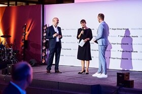 Hager Group Awards 2023 I Sabine Busse and Daniel Hager speaking on the stage