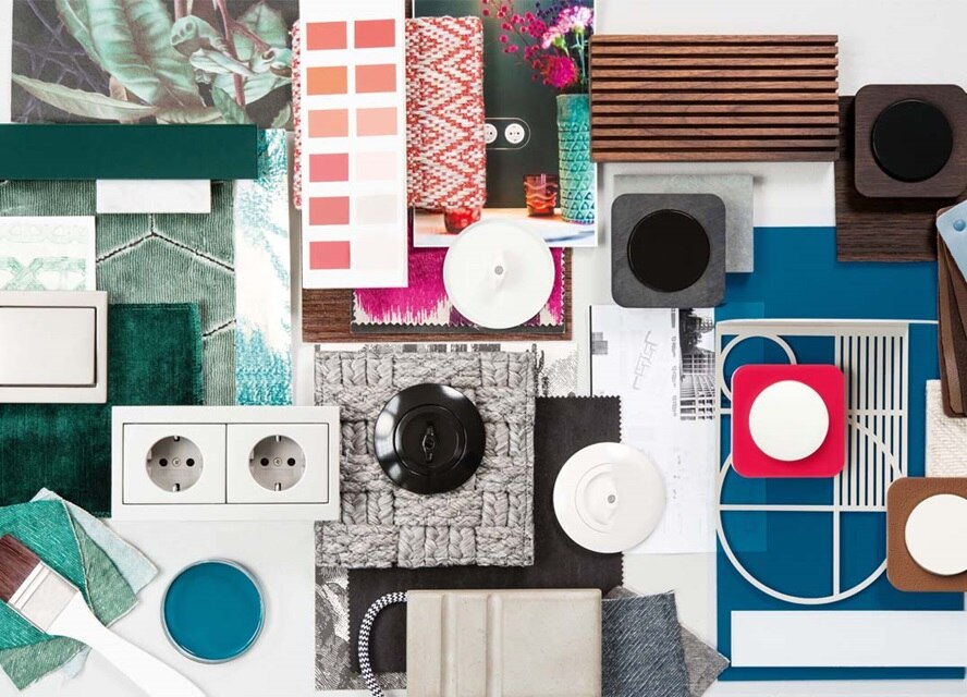 Interior design mood board with fabric swatches, paint samples, and electrical outlets and switches