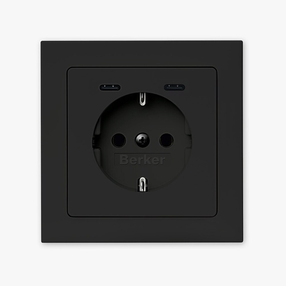 Vista frontale della presa tipo shuko Berker Q.3 con 2 porte di ricarica USB-C e cornice nera su sfondo neutro