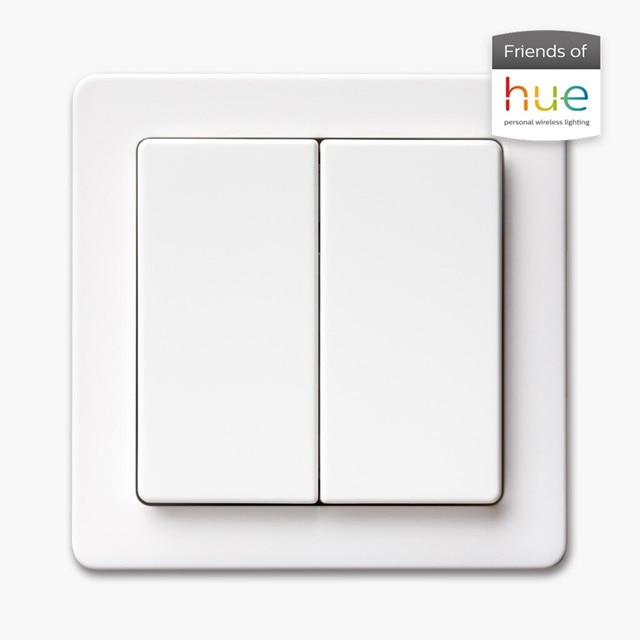 Vista frontale dell'interruttore della luce Berker Q.1 con bilanciere a 2 vie e cornice in bianco, accanto ad esso l'emblema Friends of Hue per la compatibilità con Philips Hue