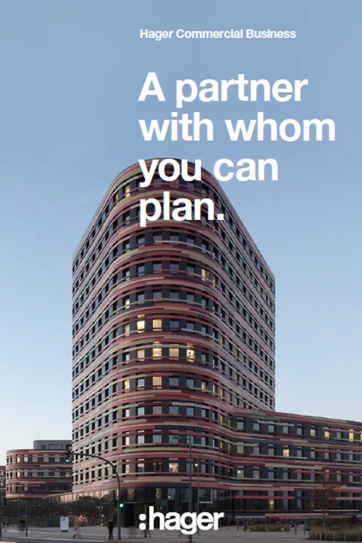 Advertisement for Hager Commercial Business featuring a modern curved office building with clear blue sky in the background.