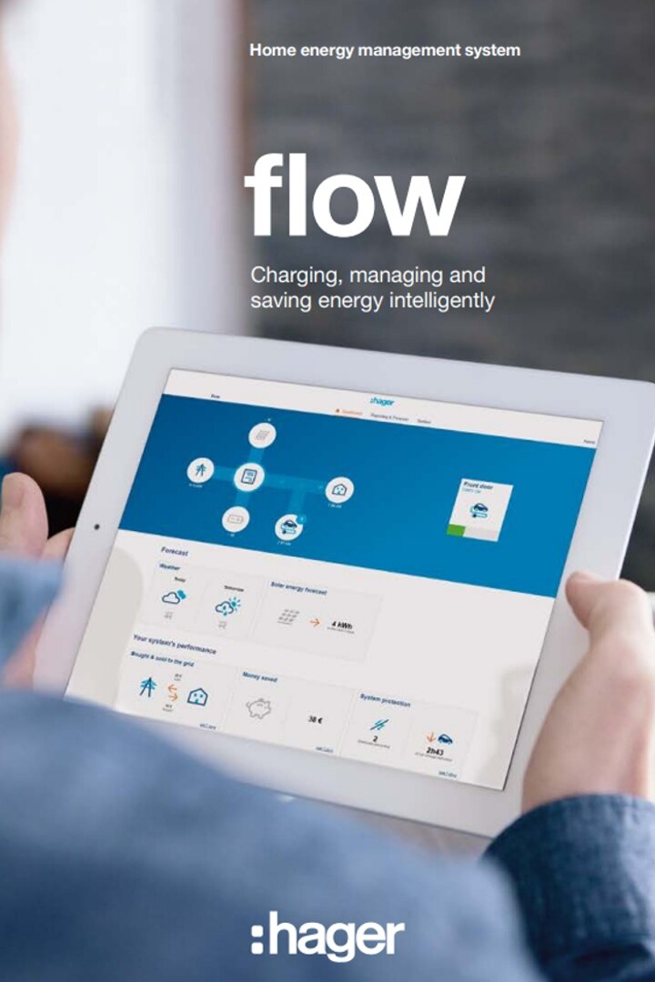 Person holding a tablet displaying the Hager home energy management system flow interface for smart energy consumption monitoring