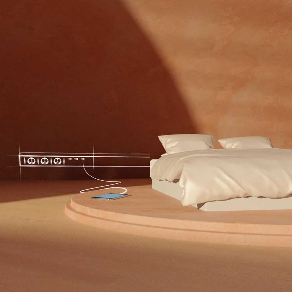 bed met aan de muur een kabelgoot met stopcontacten getekend