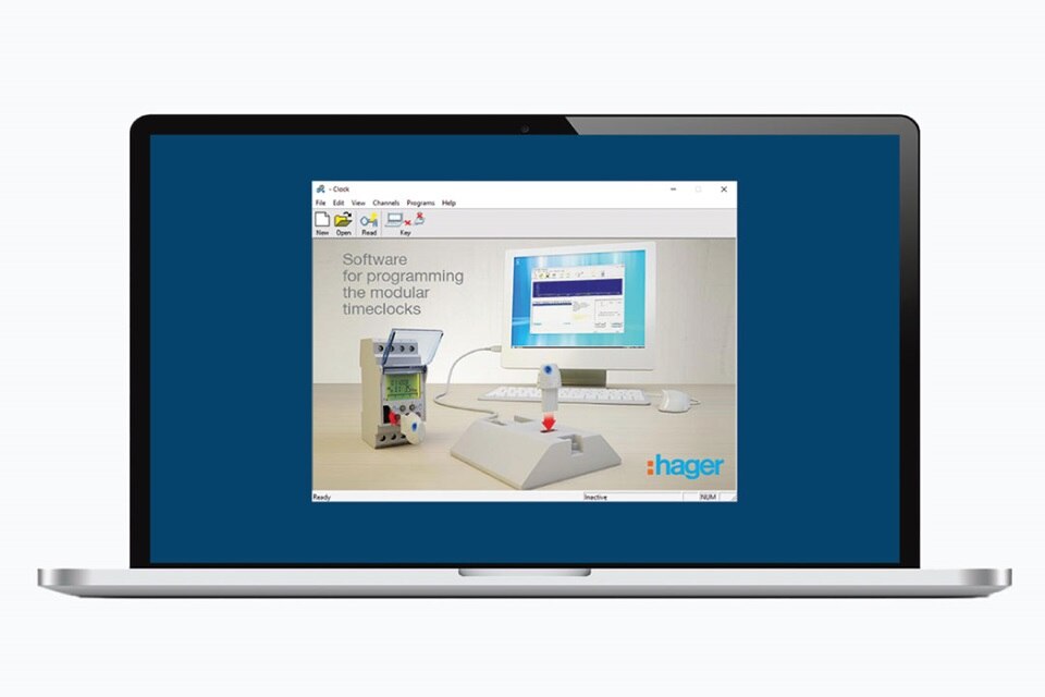 Hager software on laptop screen showing programming interface for modular time clocks