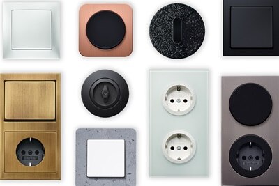 Samling av olika väggströmbrytare och eluttag i olika stilar och färger