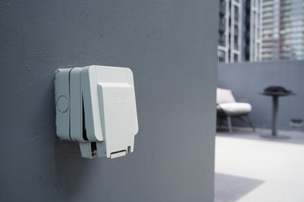 Hager outdoor socket on a gray wall 3